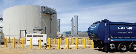 Phase 1 of CR&R’s new AD system has capacity to process 83,600 tons/year of yard trimmings and food waste. Four Eisenmann digesters are housed in the rectangular building; the fueling station is in the foreground. Photo courtesy of CR&R, Inc.